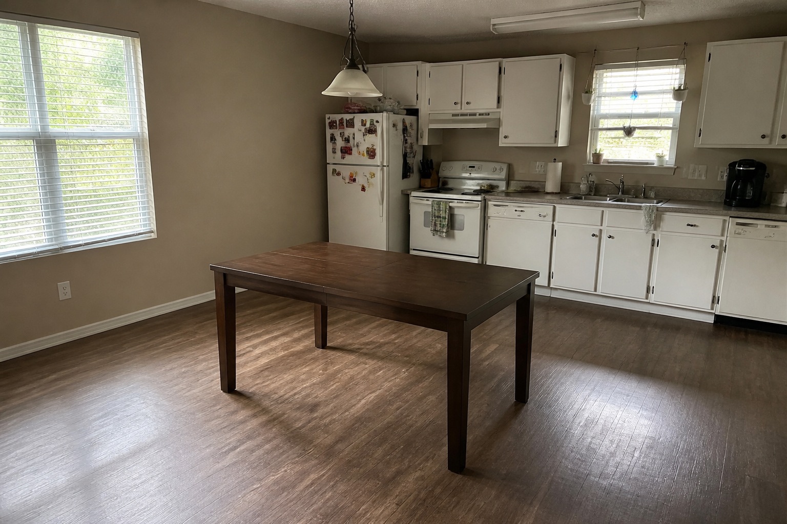 Room with dark wood dining table, before