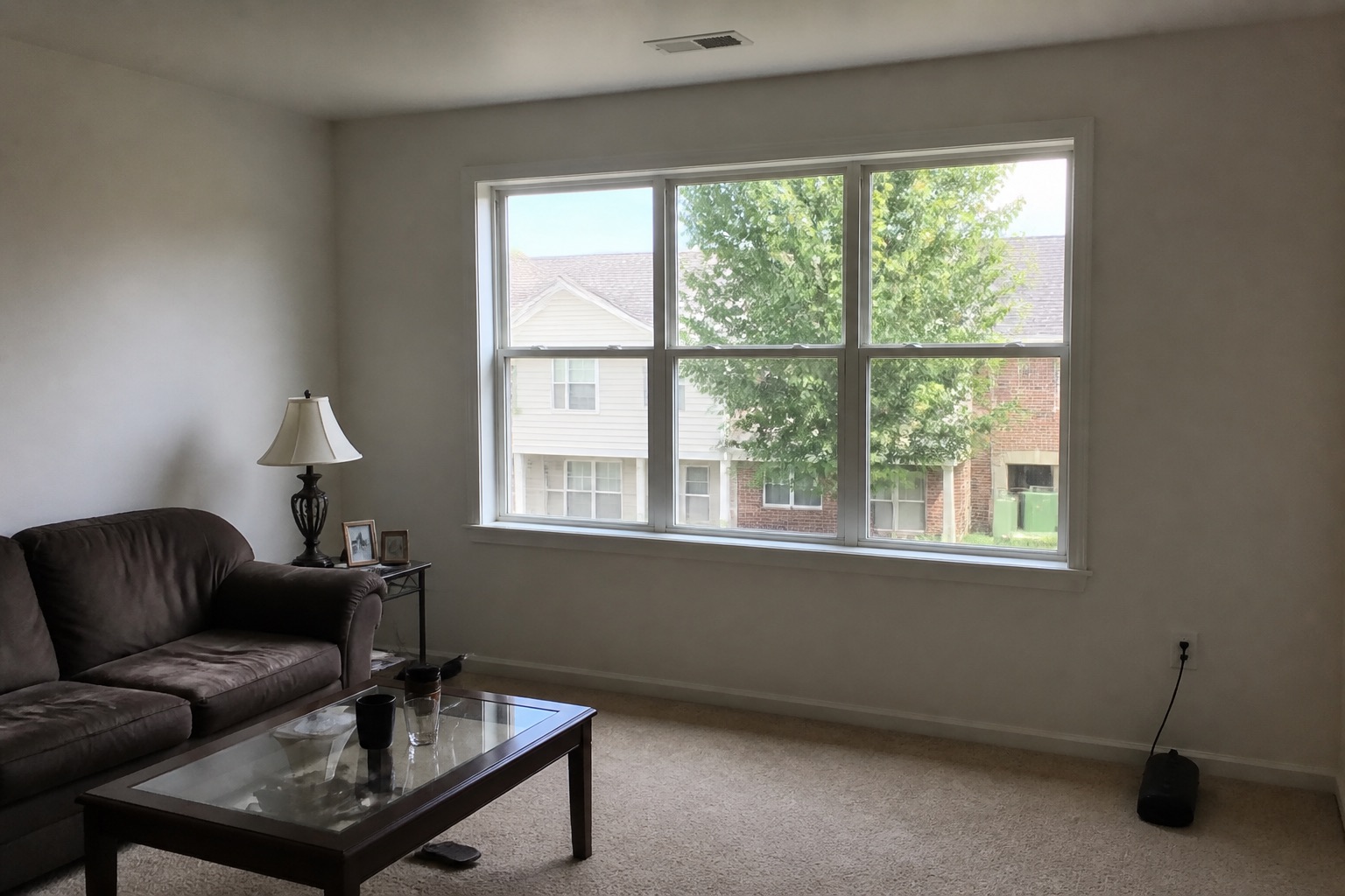 Room with a wide living room window, before