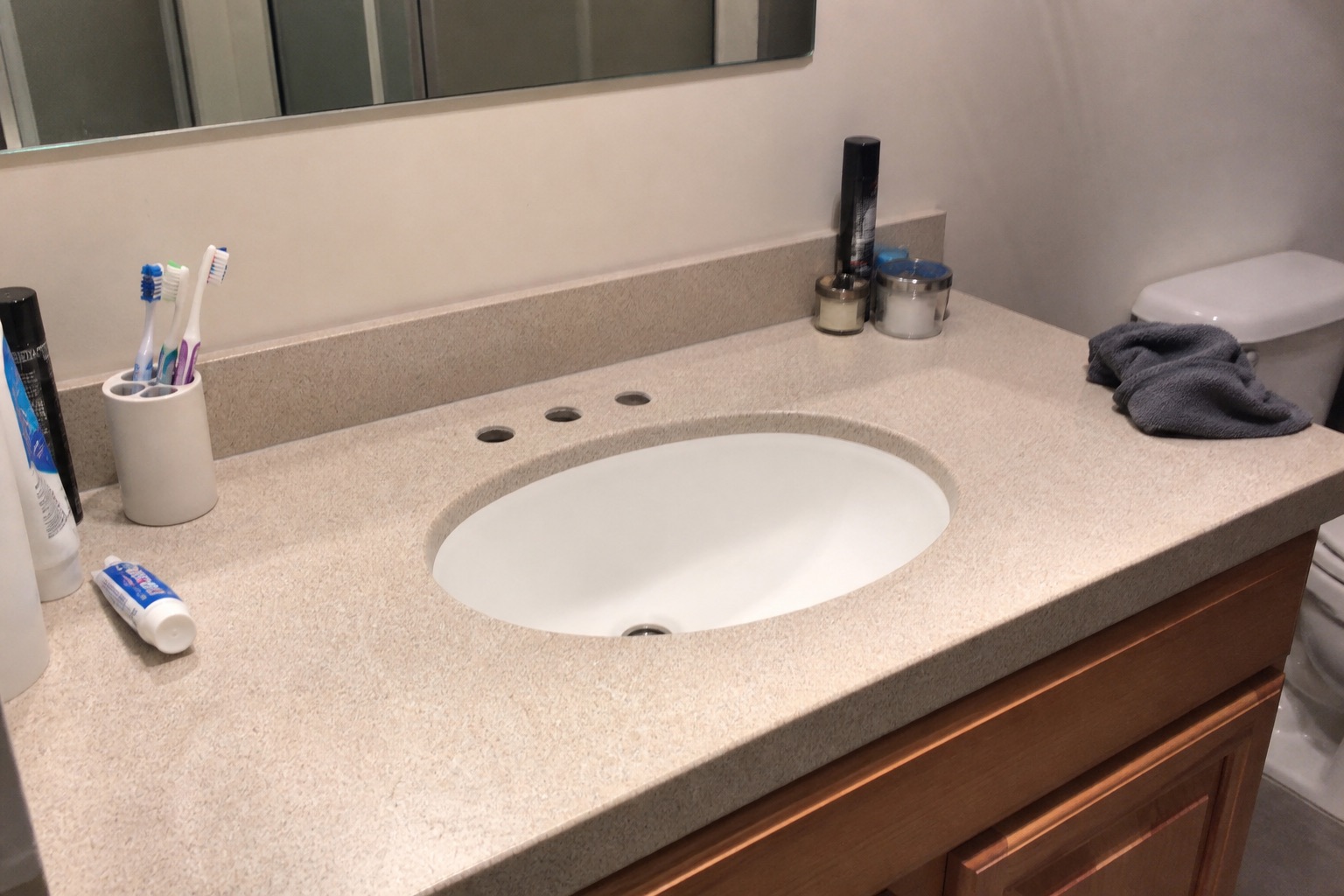 Room with a three-hole bathroom sink, before